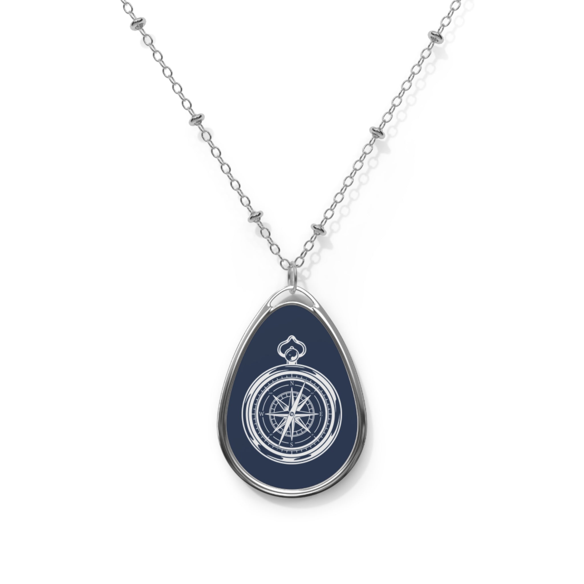Compass blue ellipse pendant | A delicate ellipse pendant that wears like a little secret