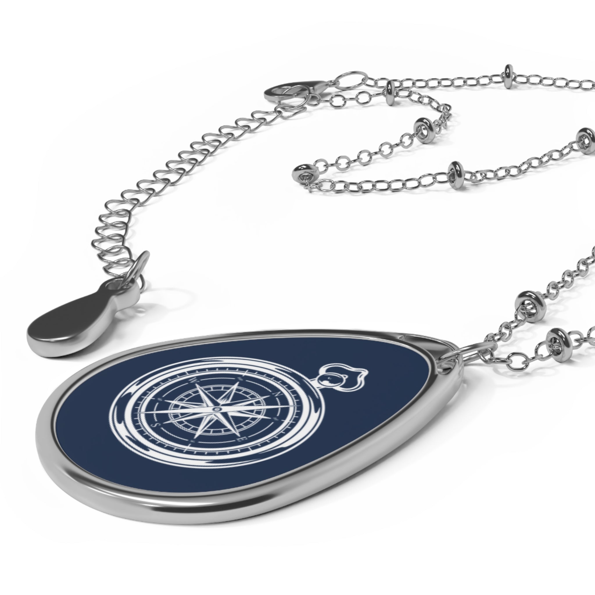 Compass blue ellipse pendant | A delicate ellipse pendant that wears like a little secret