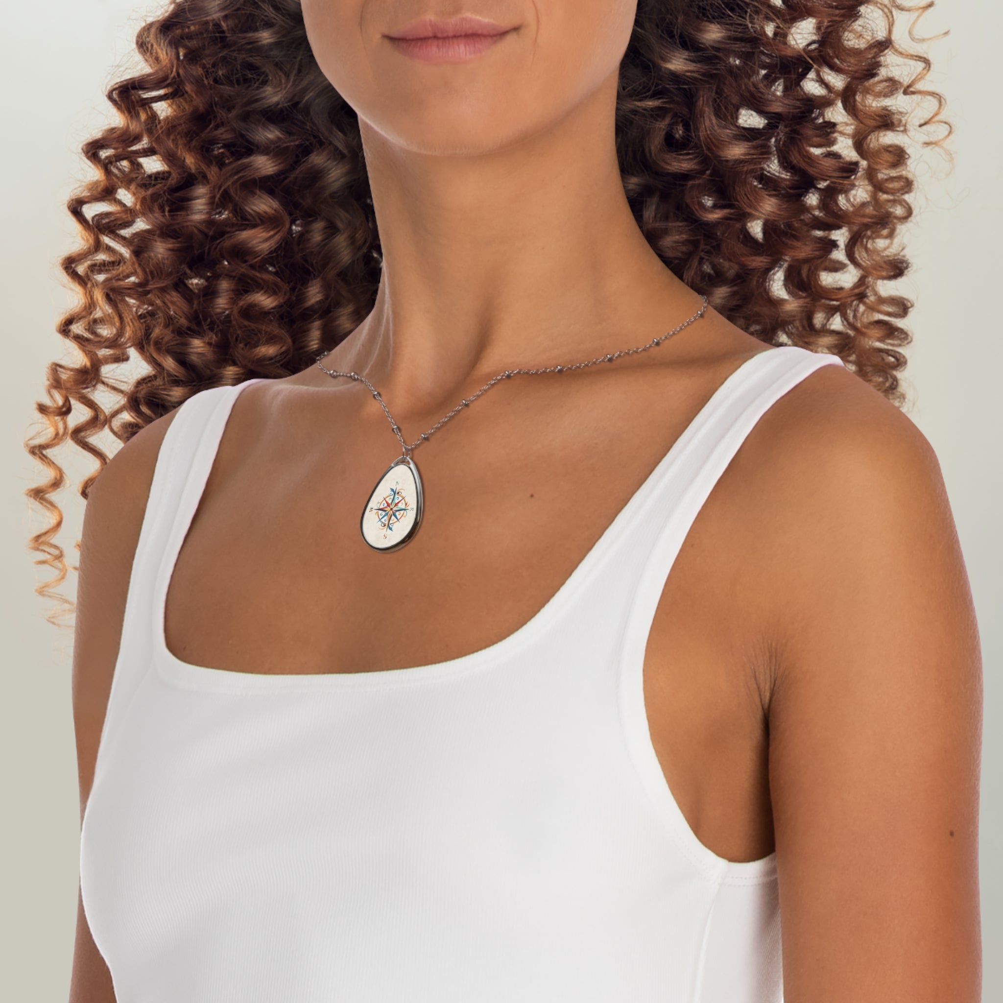Windrose white ellipse pendant | A delicate ellipse pendant that wears like a little secret