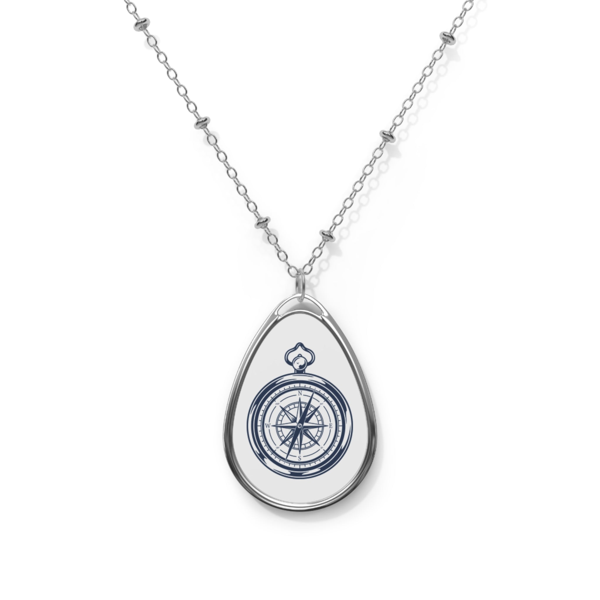 Compass white ellipse pendant | A delicate ellipse pendant that wears like a little secret