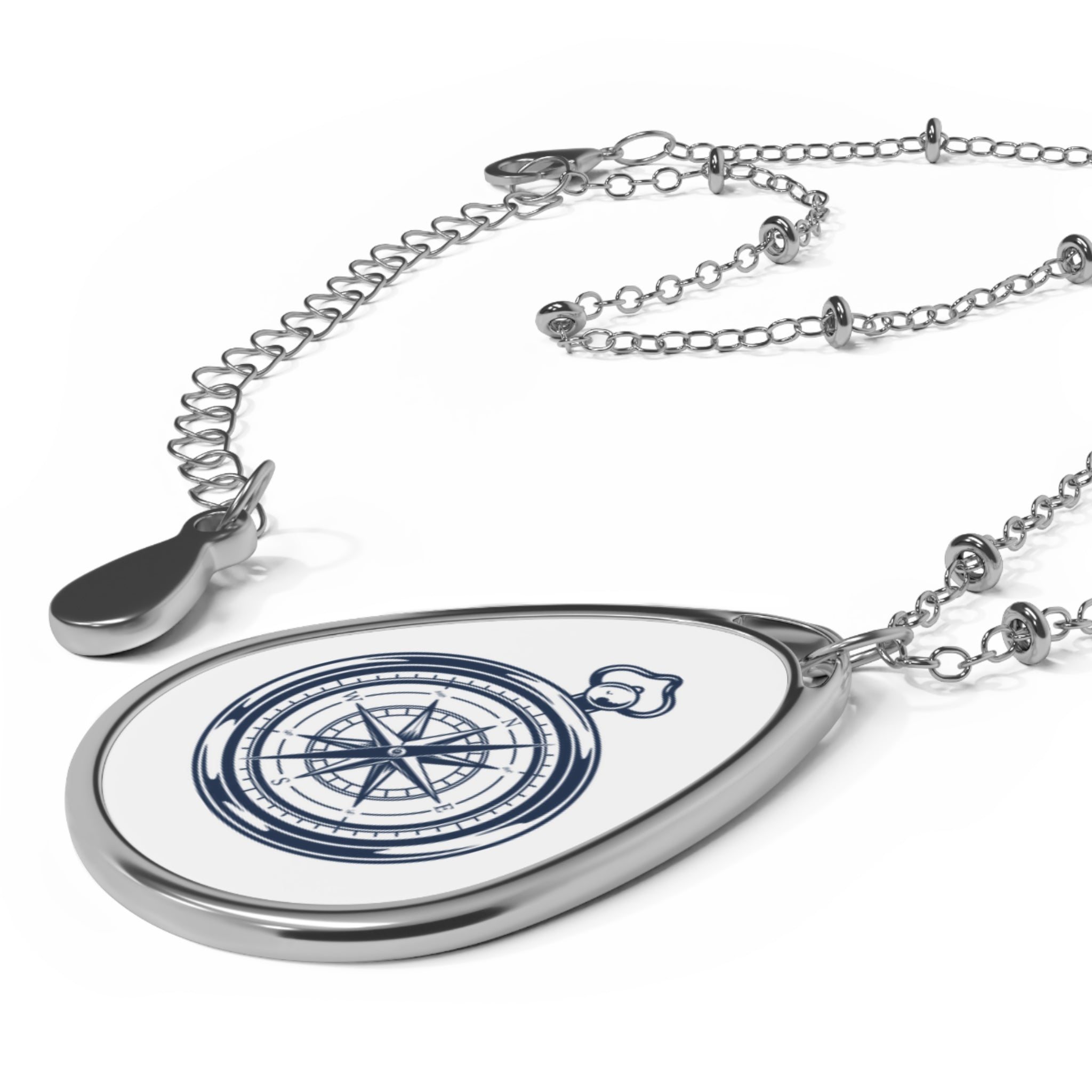 Compass white ellipse pendant | A delicate ellipse pendant that wears like a little secret