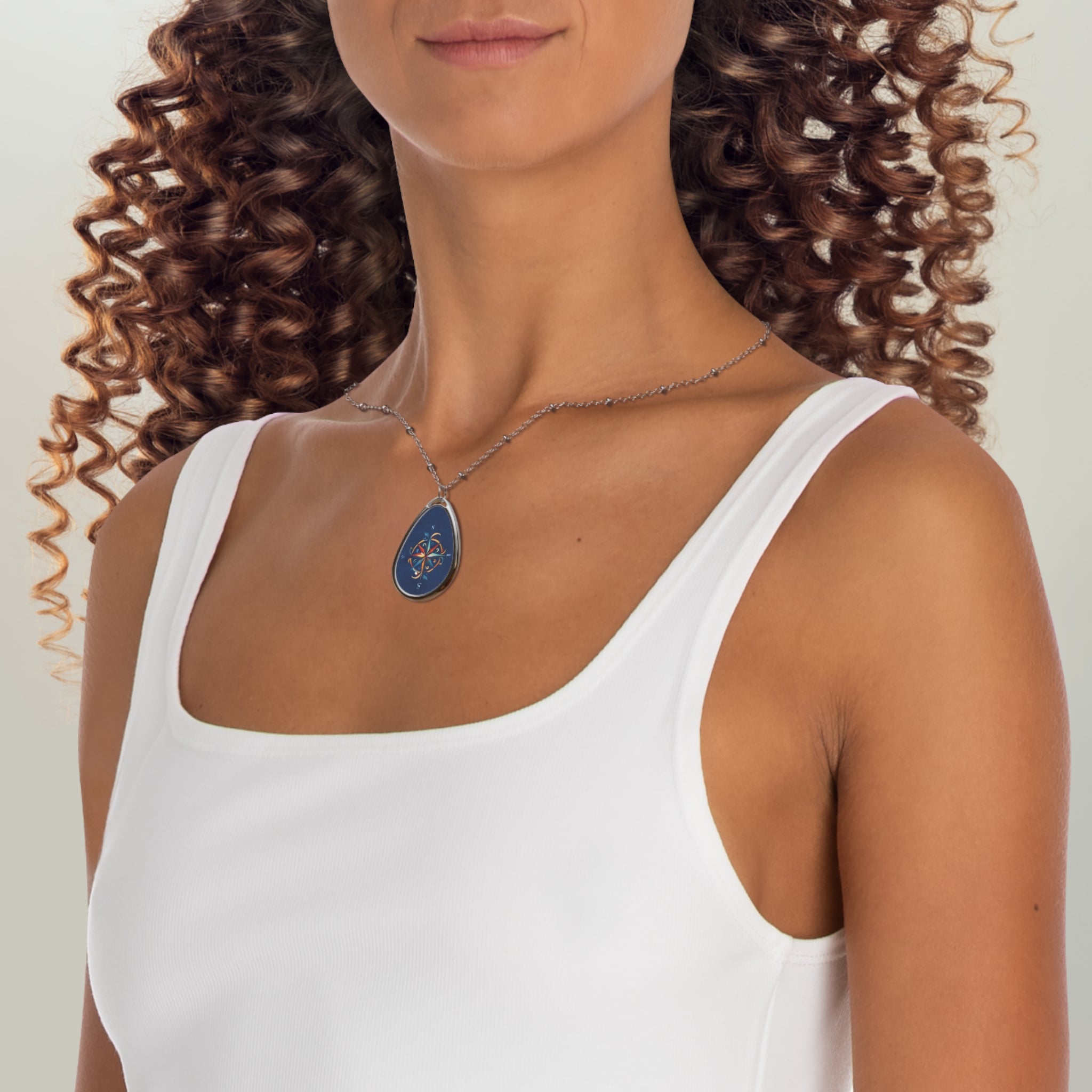 Windrose blue ellipse pendant | A delicate ellipse pendant that wears like a little secret